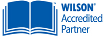 Wilson Accredited Partner logo with an open book icon.