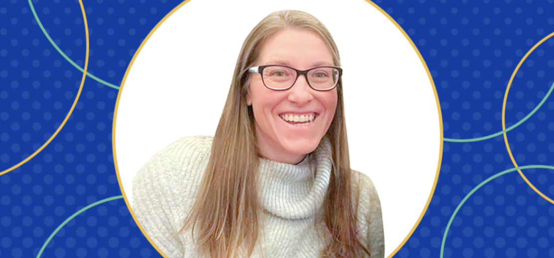Sarah Wilson, founder of Wilson Works, smiles in a cozy sweater.