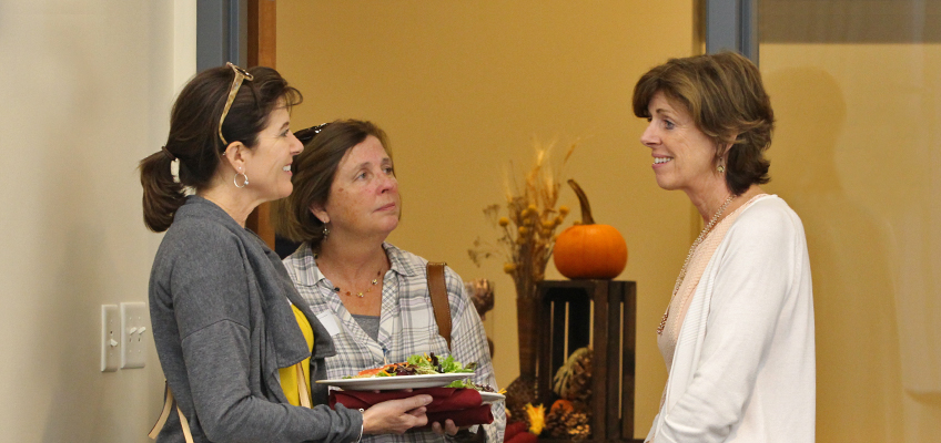 Women chat at the 2017 Parent Night event.