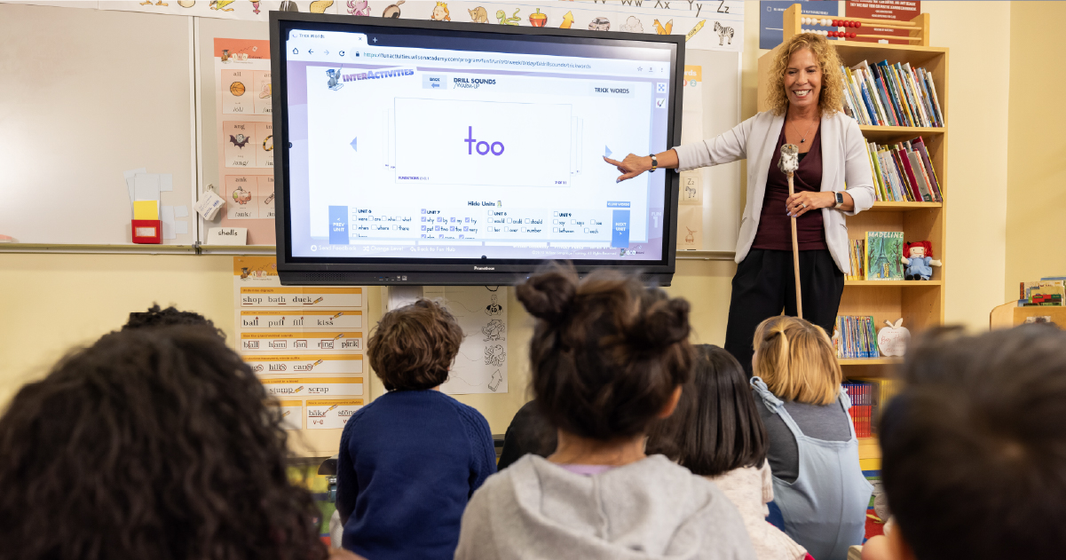 Teacher points to