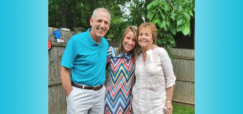 Marianna with her mentors, a smiling couple outdoors