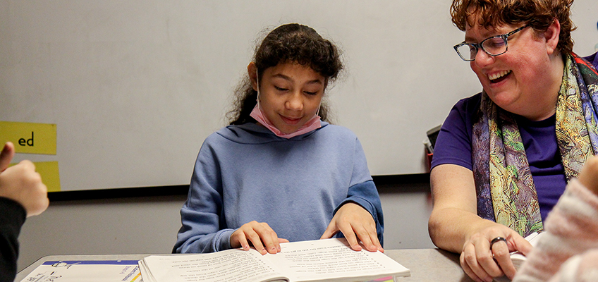 Student reading with teacher, Orton-Gillingham and Wilson Reading System®