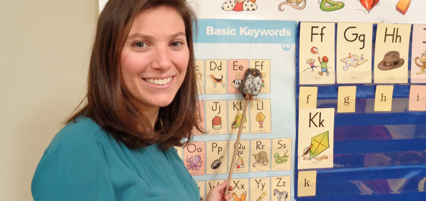 Teacher points to Fundations Pre-K alphabet chart at Tobin School
