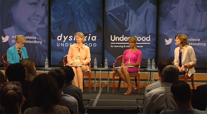 Four women on stage discussing dyslexia at