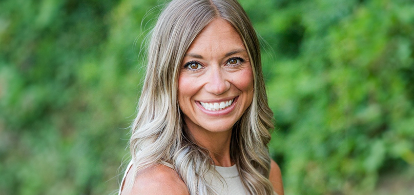 Literacy mentor smiling, making connections to close learning gaps