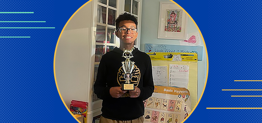 Pre-teen boy holding trophy, WRS success story